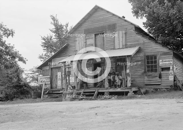 Country store on dirt road, Sunday afternoon, near Gordenton, North Carolina, 1939. Creator: Dorothea Lange.