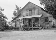 Country store on dirt road, Sunday afternoon, near Gordenton, North Carolina, 1939. Creator: Dorothea Lange