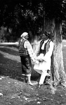 Couple in traditional costume, Bistrita Valley, Moldavia, north-east Romania, c1920-c1945. Artist: Adolph Chevalier