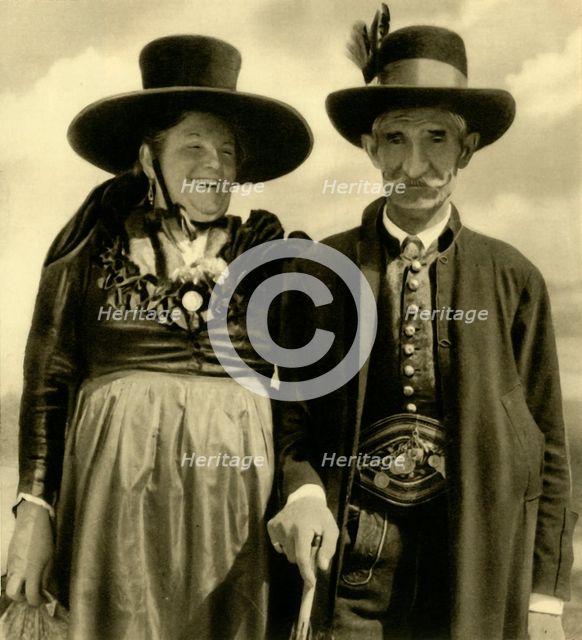 Couple in traditional dress, Sankt Lambrecht, Styria, Austria, c1935.  Creator: Unknown.