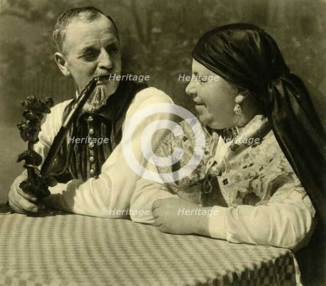 Couple in traditional dress, Upper Austria, c1935.  Creator: Unknown.