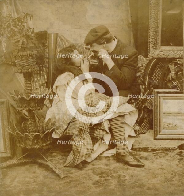 Couple lighting a cigarette from each other, 1900. Artist: Unknown