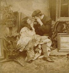 Couple lighting a cigarette from each other, 1900