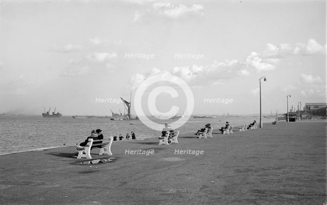 Couples sit on benches on the promenade at Gravesend, Kent, c1945-c1965. Artist: SW Rawlings