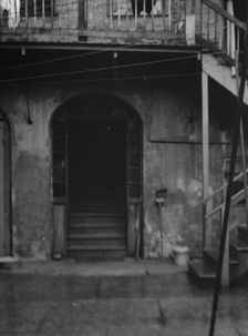 Courtyard, New Orleans, between 1920 and 1926. Creator: Arnold Genthe