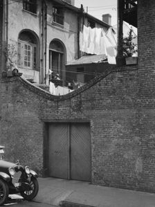 Courtyard with a garage, New Orleans, between 1920 and 1926. Creator: Arnold Genthe