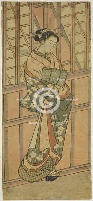 Courtesan Standing in Front of a Barred Window, c. 1765. Creator: Ishikawa Toyonobu.