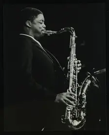 Courtney Pine playing tenor saxophone at the Forum Theatre, Hatfield, Hertfordshire, 8 April 1987. Creator: Denis Williams