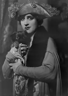 Cowl, Jane, Miss, with dog, portrait photograph, 1918 Oct. 14. Creator: Arnold Genthe