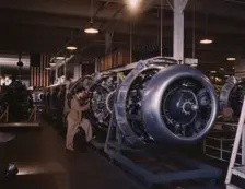 Cowling and control rods are added to motors for...North American Inc., Inglewood, Calif., 1942. Creator: Alfred T Palmer