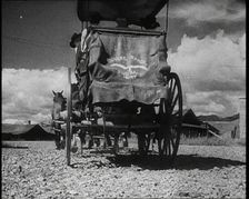 Coach and Horses Waiting To Pick up Passengers Arriving Off the Train, 1932. Creator: British Pathe Ltd