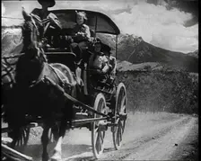 Coach and Horses Picking up Passengers Arriving Off the Train And Driving Through the Prairie, 1932. Creator: British Pathe Ltd