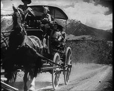 Coach and Horses Picking up Passengers Arriving Off the Train And Driving Through the Prairie, 1932. Creator: British Pathe Ltd