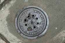 Coal hole plate outside 48 Arbour Square, Stepney, Tower Hamlets, London, 2010. Artist: Derek Kendall