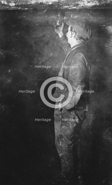 Coal Mining, Fireman searching for Gas postcard, c1900s. Creator: Unknown.