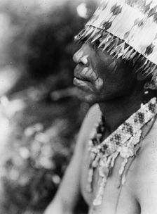 Coast Pomo with feather head-dress, c1924. Creator: Edward Sheriff Curtis