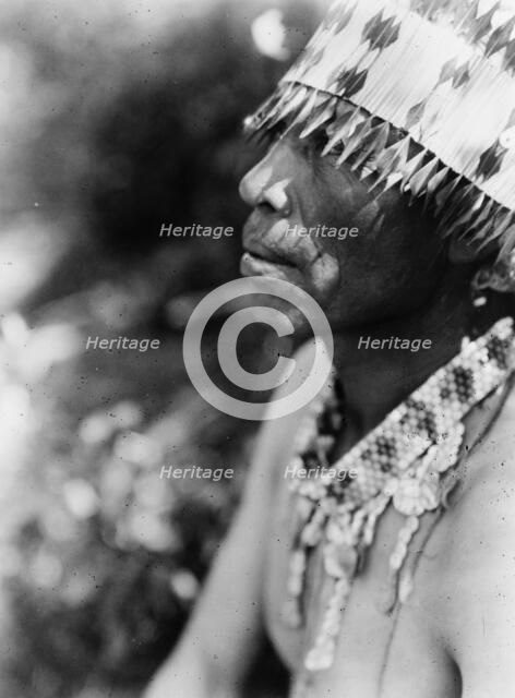 Coast Pomo with feather head-dress, c1924. Creator: Edward Sheriff Curtis.