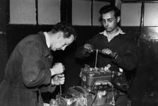 Colin Chapman with Peter Allen in Lotus workshop. Creator: Unknown