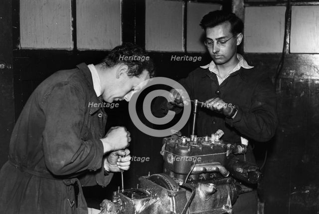Colin Chapman with Peter Allen in Lotus workshop. Creator: Unknown.