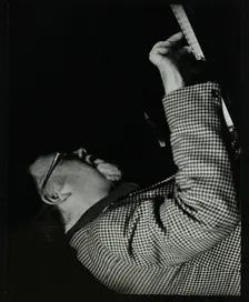 Colin Bates on the piano at The Stables, Wavendon, Buckinghamshire. Creator: Denis Williams