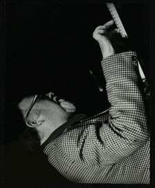 Colin Bates on the piano at The Stables, Wavendon, Buckinghamshire. Creator: Denis Williams