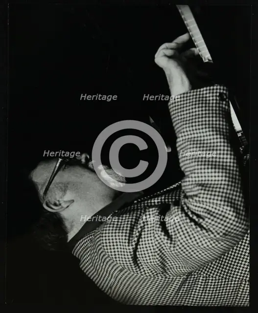 Colin Bates on the piano at The Stables, Wavendon, Buckinghamshire. Creator: Denis Williams.