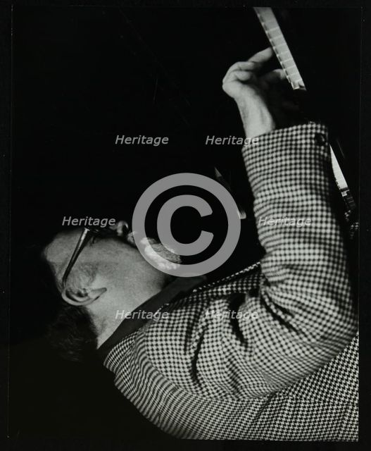 Colin Bates on the piano at The Stables, Wavendon, Buckinghamshire. Creator: Denis Williams.