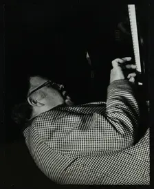 Colin Bates on the piano at The Stables, Wavendon, Buckinghamshire. Creator: Denis Williams
