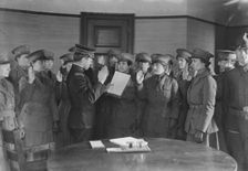 Colonel J.H. Wells swearing in woman motorist, 29 May 1917. Creator: Bain News Service