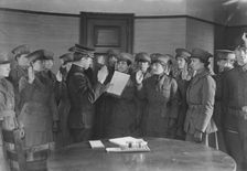 Colonel J.H. Wells swearing in woman motorist, 29 May 1917. Creator: Bain News Service