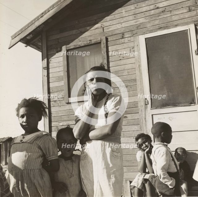 Colored family from near Houston, Texas. Been in California for two years. Husband came..., 1939. Creators: Farm Security Administration, Dorothea Lange.