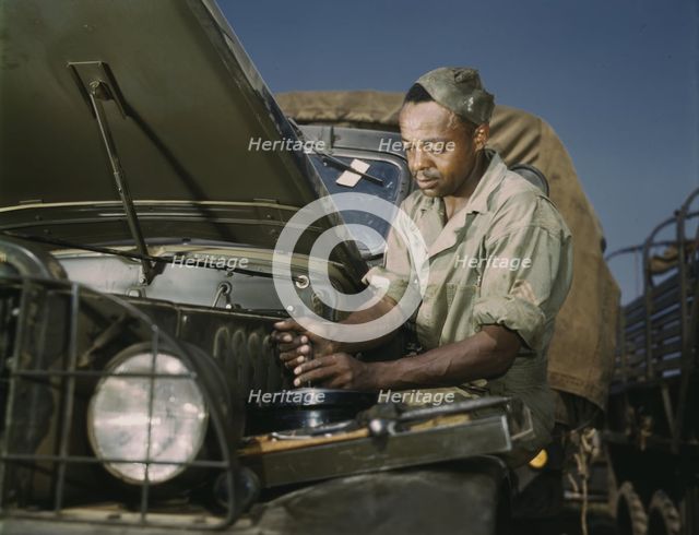 Colored mechanic, motor maintenance section, Ft. Knox, Ky., 1942. Creator: Alfred T Palmer.