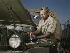 Colored mechanic, motor maintenance section, Ft. Knox, Ky., 1942. Creator: Alfred T Palmer