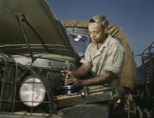 Colored mechanic, motor maintenance section, Ft. Knox, Ky., 1942. Creator: Alfred T Palmer