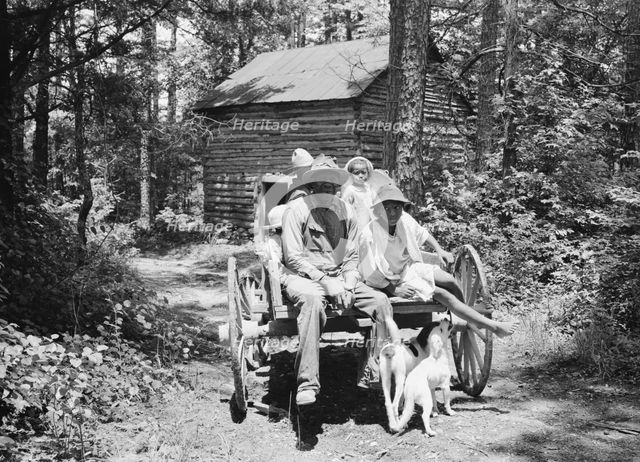 Colored sharecropper and his children about to leave..., Shoofly, North Carolina, 1939. Creator: Dorothea Lange.
