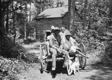 Colored sharecropper and his children about to leave..., Shoofly, North Carolina, 1939. Creator: Dorothea Lange