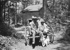 Colored sharecropper and his children about to leave..., Shoofly, North Carolina, 1939. Creator: Dorothea Lange