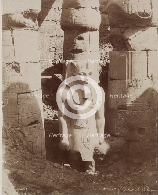 Colossal Statue of Ramesses II in the First Court of the Temple at Luxor, 19th century. Creator: Zangaki.