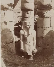 Colossal Statue of Ramesses II in the First Court of the Temple at Luxor, 19th century. Creator: Zangaki