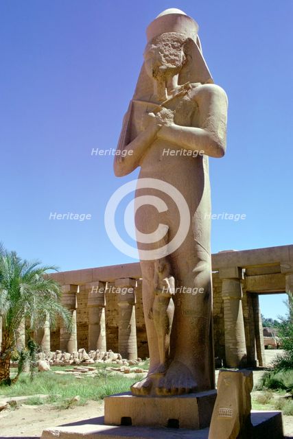 Colossal statue, Karnak, Egypt. Creator: Tony Evans.