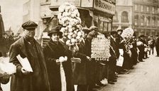 Coloured football favours and match programmes for sale, Walham Green, London, 20th century