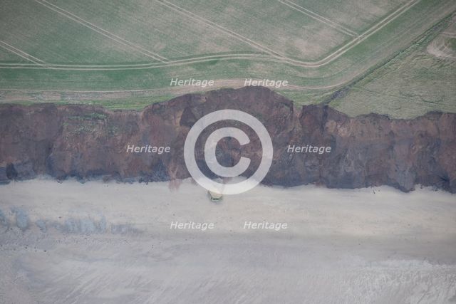 Collapsed pillbox on the beach, near Beacon Hill, East Riding of Yorkshire, 2014. Creator: Historic England Staff Photographer.