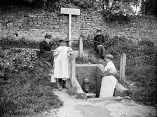 Collecting water from the village pump, Barton Hartshorn, Buckinghamshire, 1901. Artist: Alfred Newton & Sons