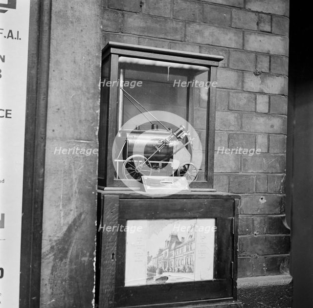 Collection box with model steam locomotive, Victoria Station, London, 1960-1972. Artist: John Gay