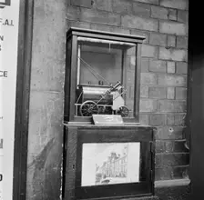 Collection box with model steam locomotive, Victoria Station, London, 1960-1972. Artist: John Gay