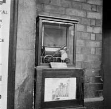 Collection box with model steam locomotive, Victoria Station, London, 1960-1972. Artist: John Gay