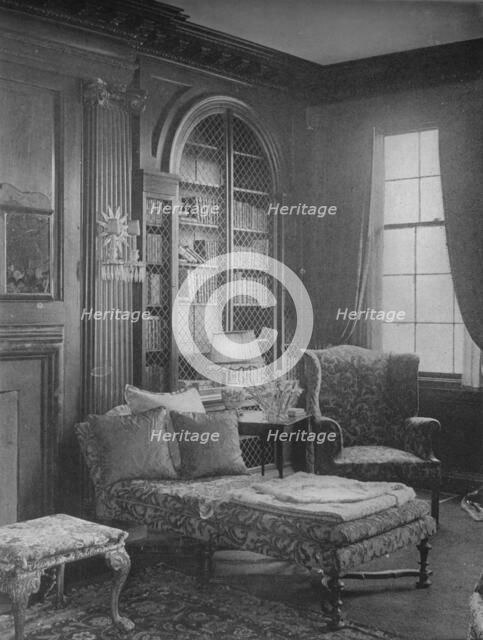 Comfortable corner in the library showing bookcase, house of Miss Anne Morgan, New York City, 1924. Artist: Unknown.