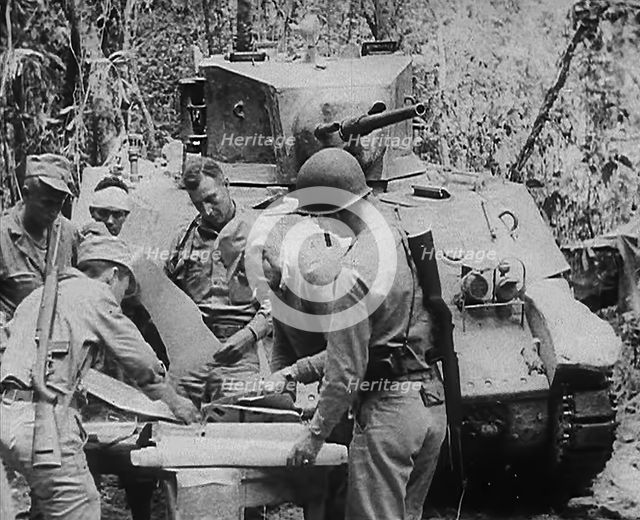 Commonwealth Troops Planning Next to a Tank, 1943. Creator: British Pathe Ltd.