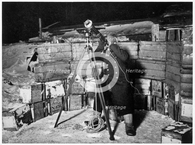 'Commander Evans observing an Occulation of Jupiter', Antarctica, 1910-1912. Creator: Herbert Ponting.