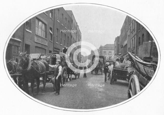 Commencing work, Osborn Street, Whitechapel, London, c1903 (1903). Artist: Unknown.